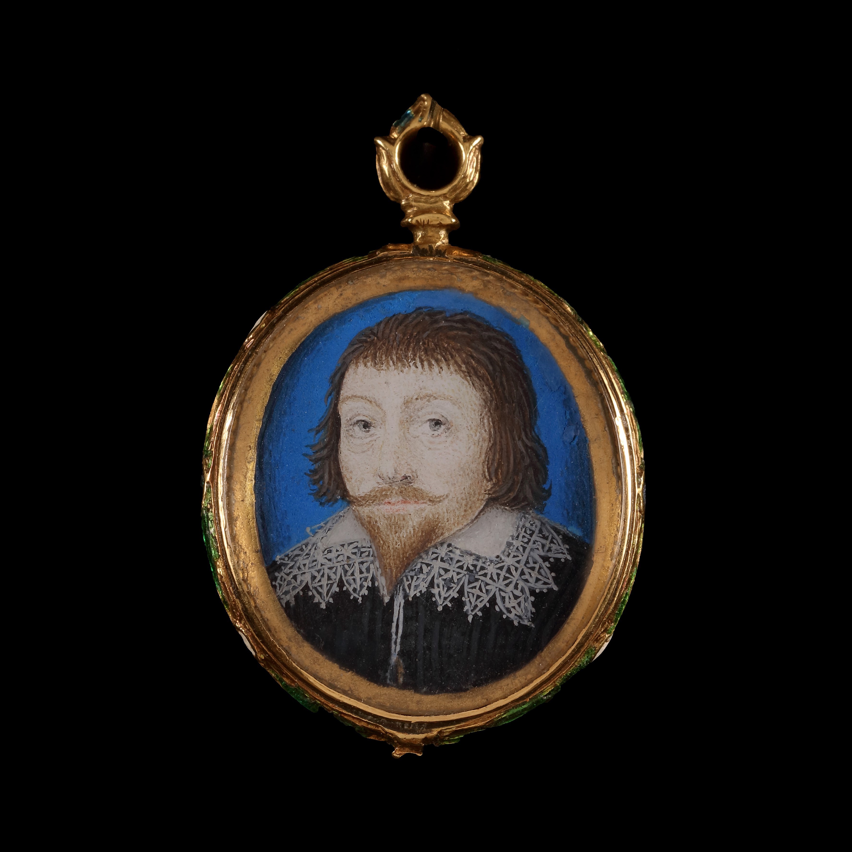 A portrait miniature of a Gentleman, wearing black doublet and white collar trimmed with lace, blue background and gold border